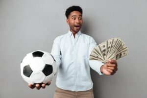 happy-smiling-african-man-showing-football-money-banknotes_171337-12877.jpg
